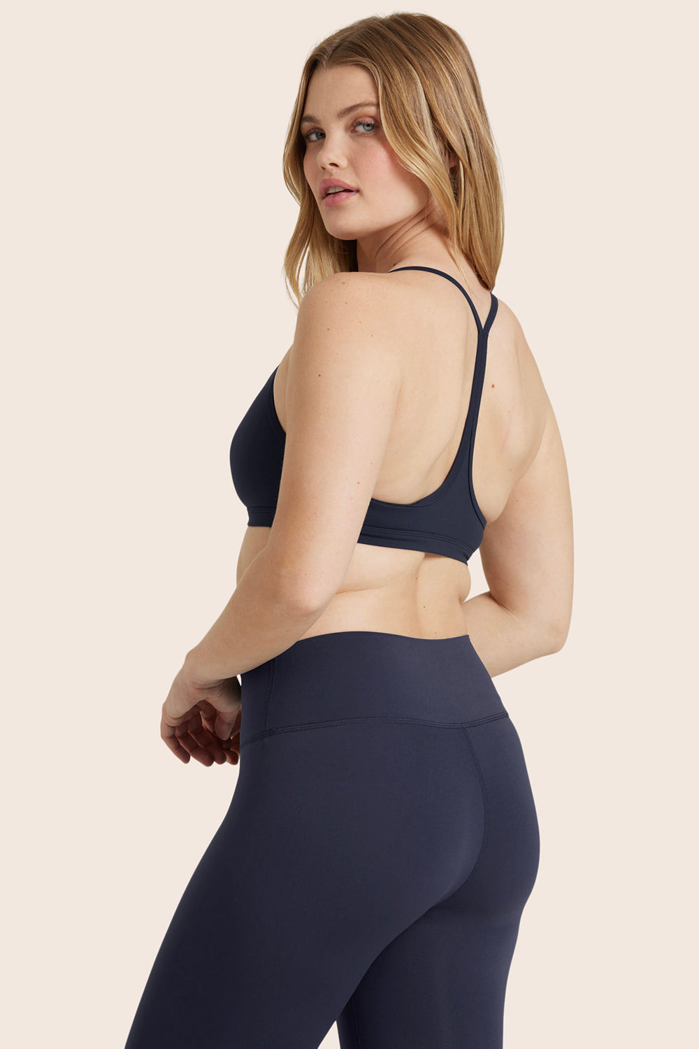 MODEL WEARS AIRLUXE™ BREATHE Y BACK BRA IN SPADES 