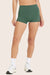 MODEL WEARS BREATHE MINI SHORTS IN JUNIPER <model-info>Gabbie wears a size S and is 5’6", 26" waist, 34" bust, 34B bra.</model-info>