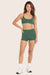 MODEL WEARS BREATHE MINI SHORTS IN JUNIPER 