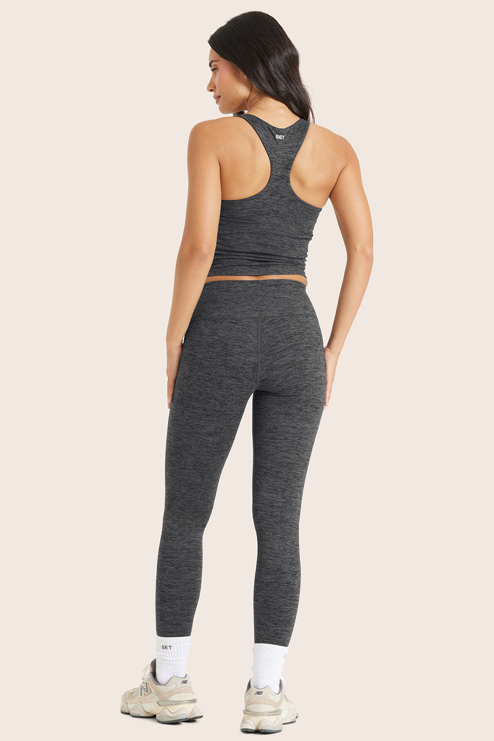 MODEL WEARS FORMCLOUD® LEGGINGS IN PEPPER HEATHER GREY