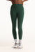 Green leggings worn by a person on a white background <model-info>Autumn wears a size S and is 5’7½“, 25" waist, 32" bust.</model-info>