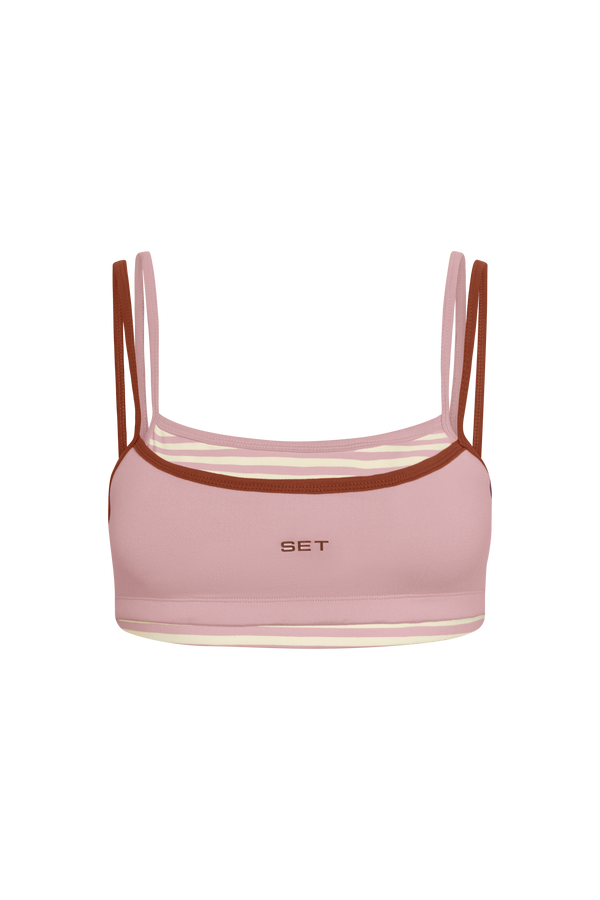 Pink crop top with brown straps and 'SET' branding on a white background