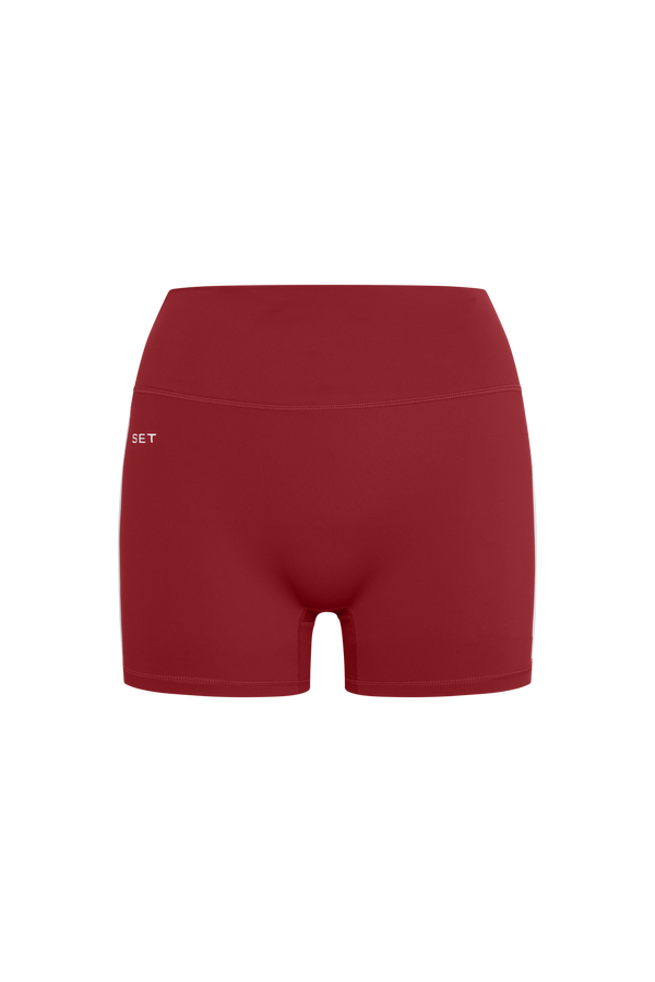 Red athletic shorts on a white background