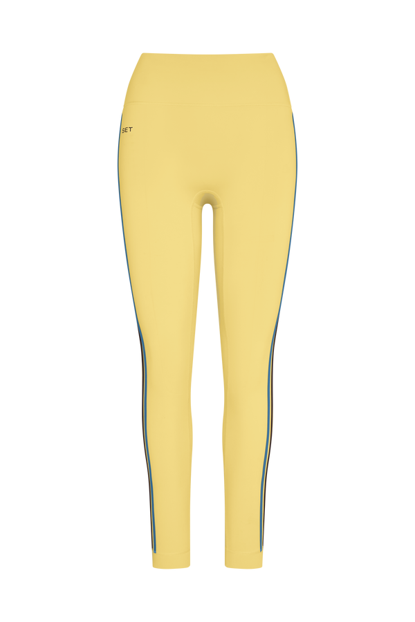 Yellow leggings with a blue stripe on a white background