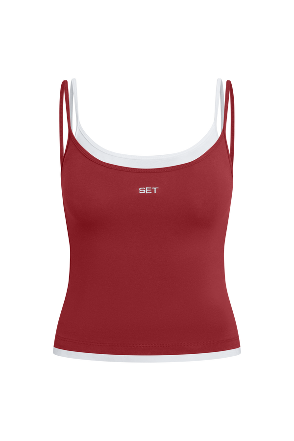 Red tank top with white trim on a white background