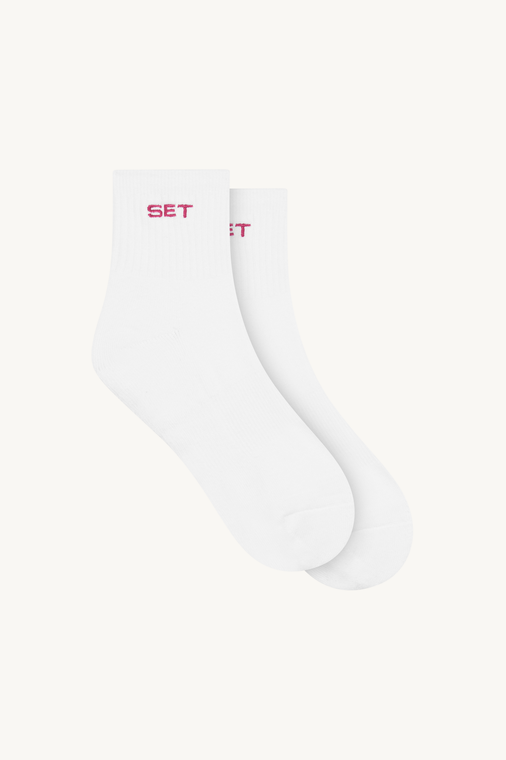White socks with red text on a white background