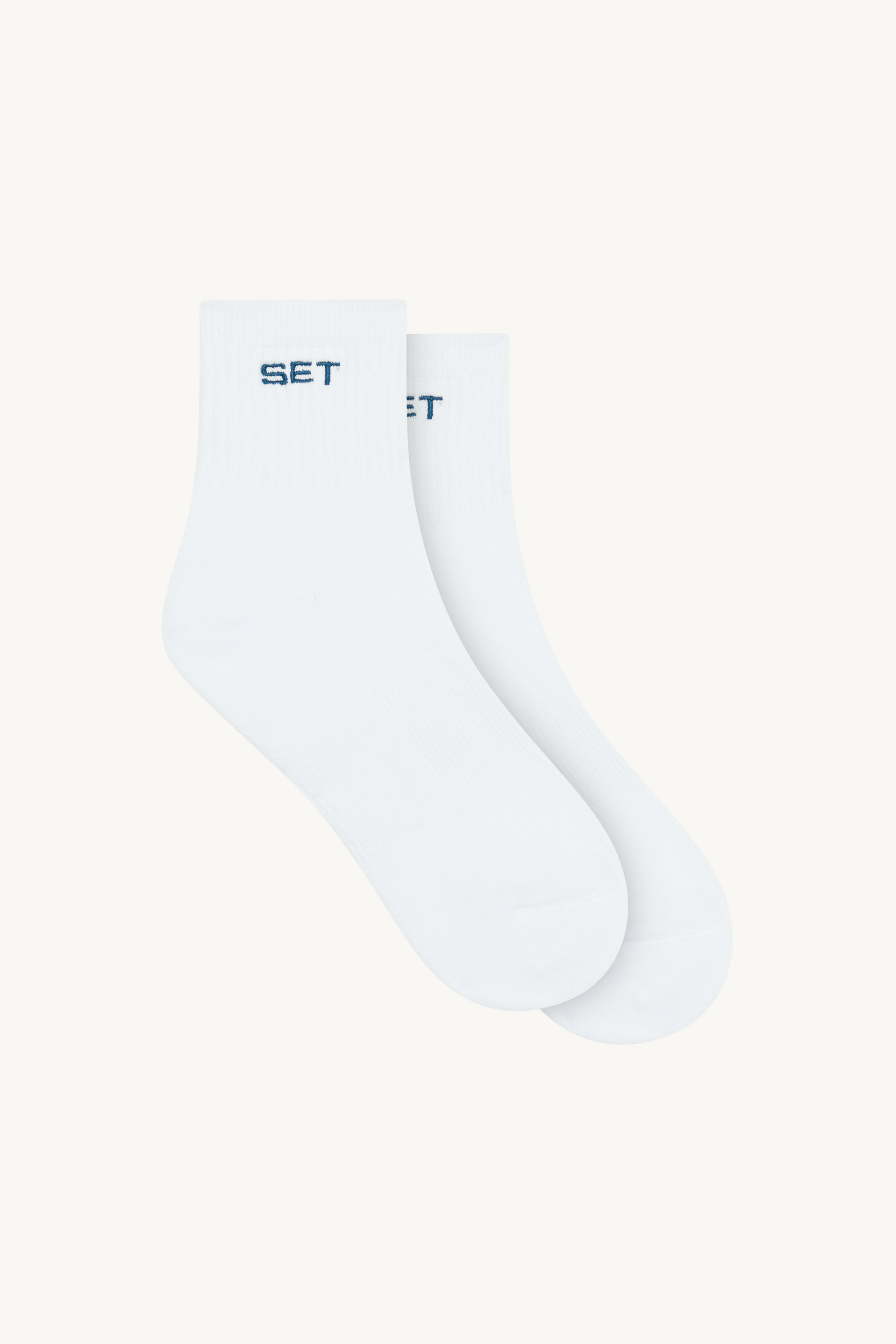 White socks with 'SET' branding on a white background