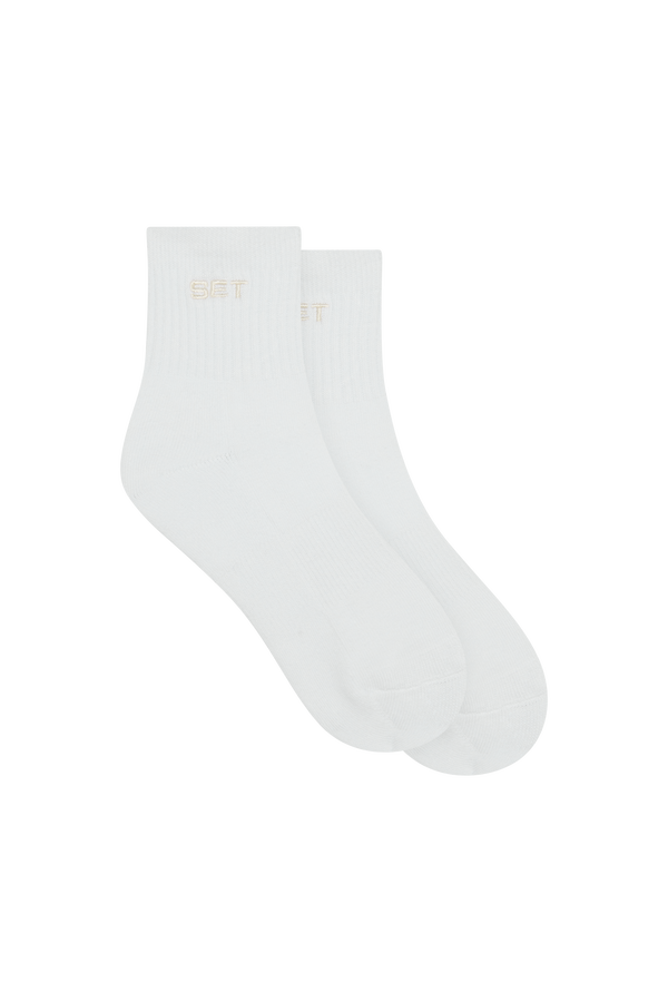 White sock with a brand logo on a white background
