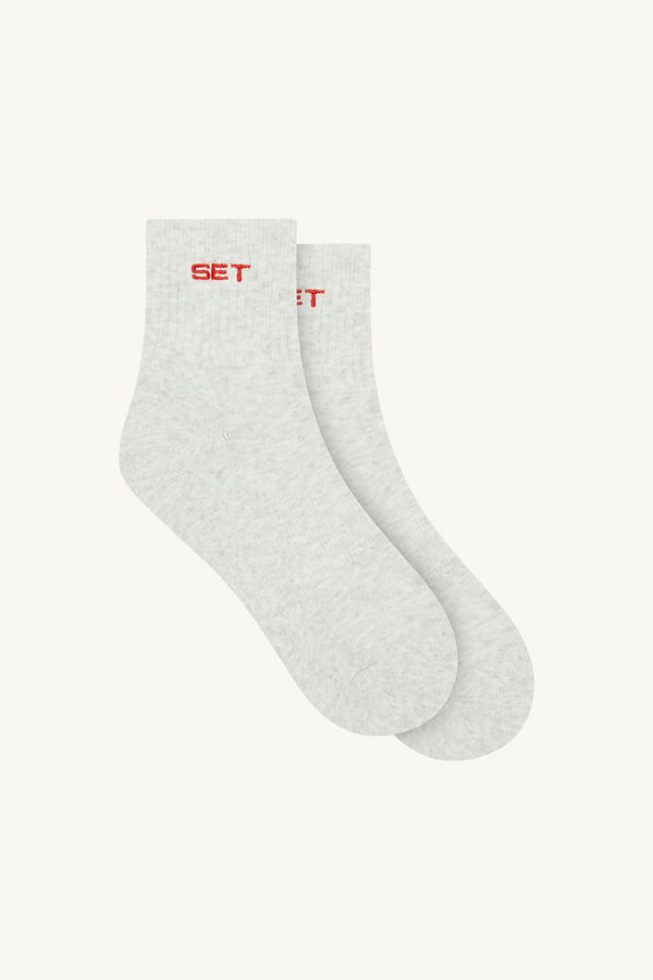 White socks with red text on a white background