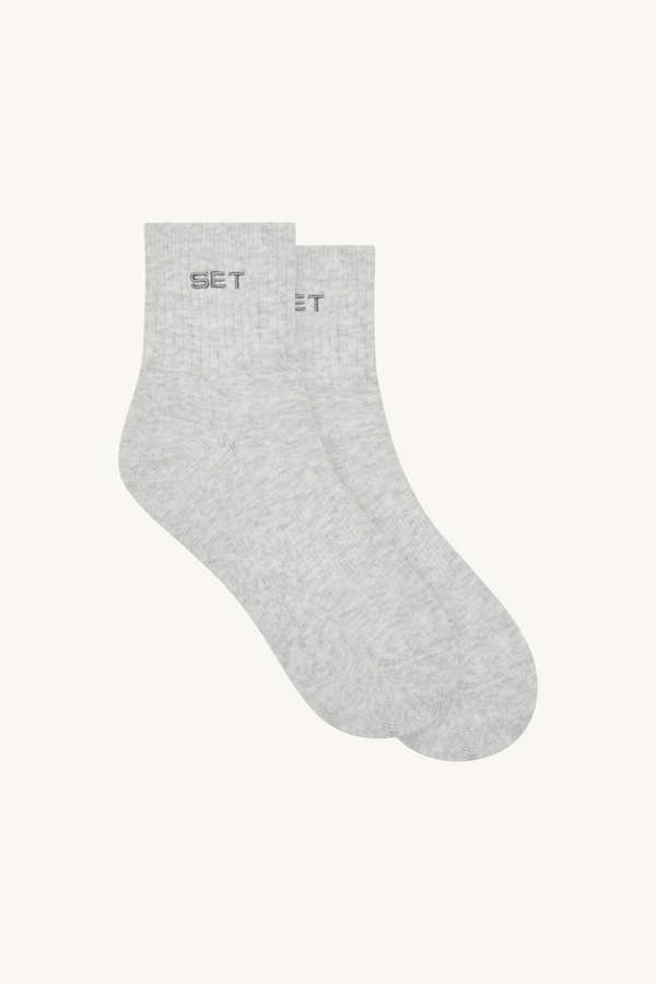 Pair of gray socks with 'SET' brand logo 