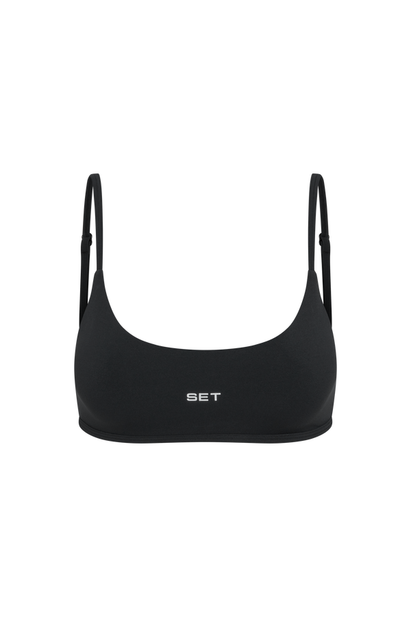 Black bikini top with 'SET' branding on a white background