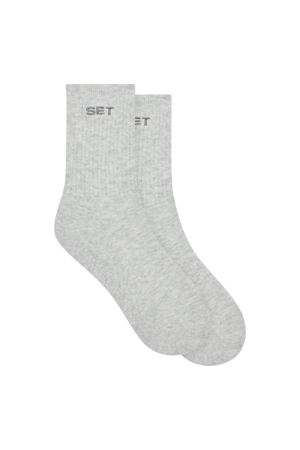Gray socks with 'SET' branding on a white background