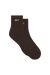 A pair of dark brown ankle socks with the word 'SET' embroidered in gold on the ribbed cuffs, displayed against a solid white background.