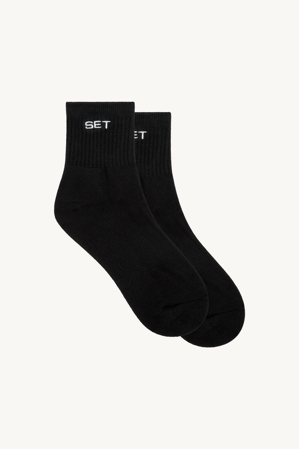 Pair of black socks with 'SET' logo 
