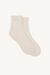 Pair of beige socks with pink logo on a white background