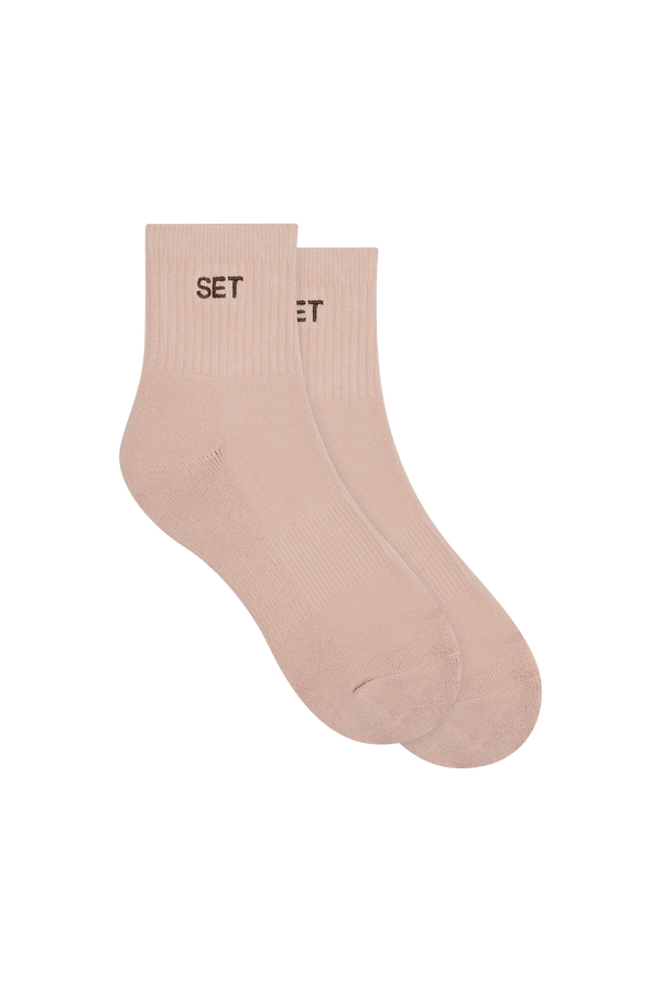 Pink socks with brown 'SET' logo