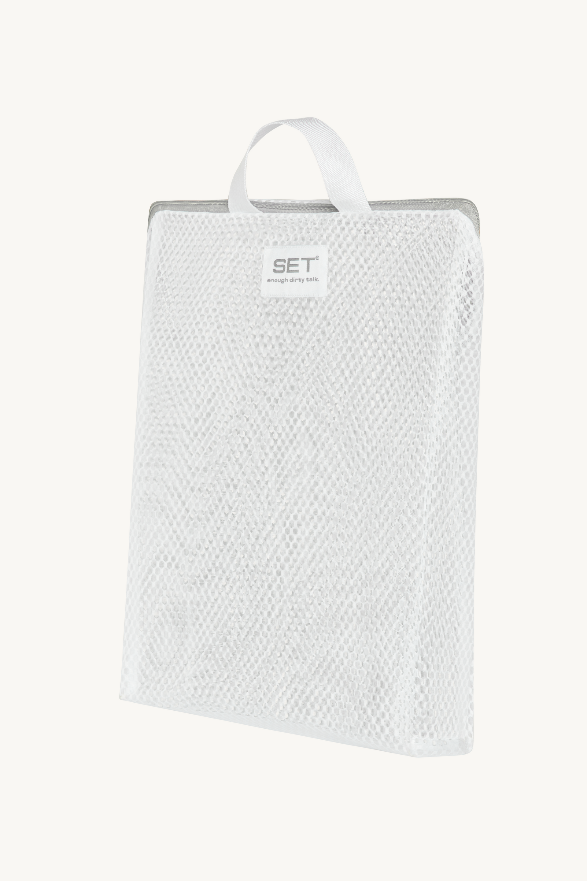 White textured towel on a hanger with 'SET' label against a white background