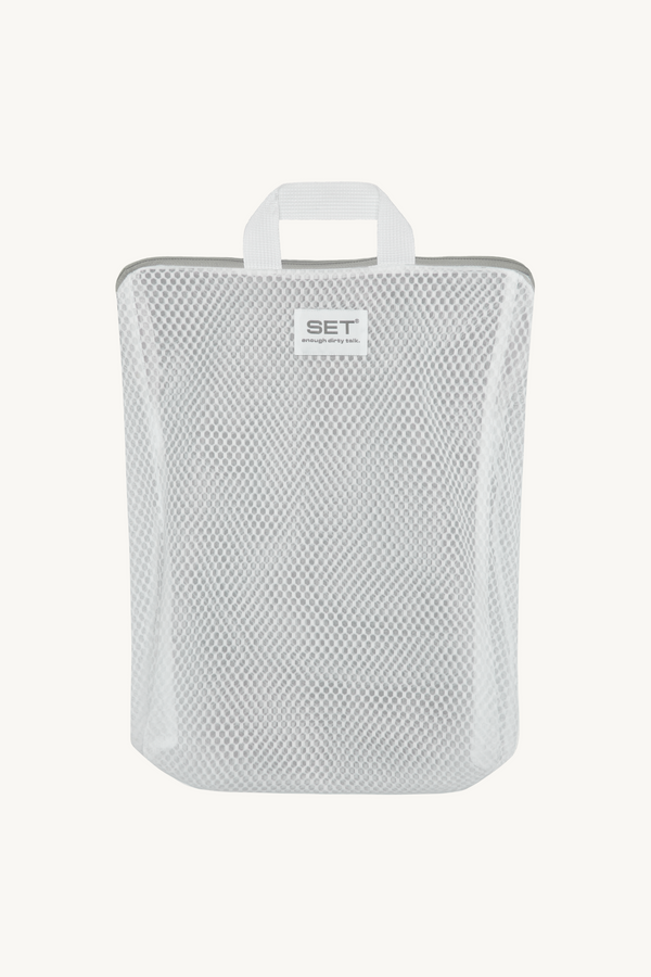 White mesh pouch with handle on a white background