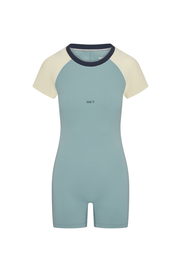 Light blue and cream one piece on a white background
