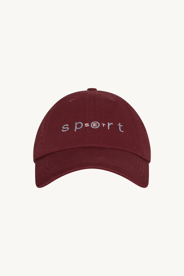 Maroon cap with 'sport' text on a white background