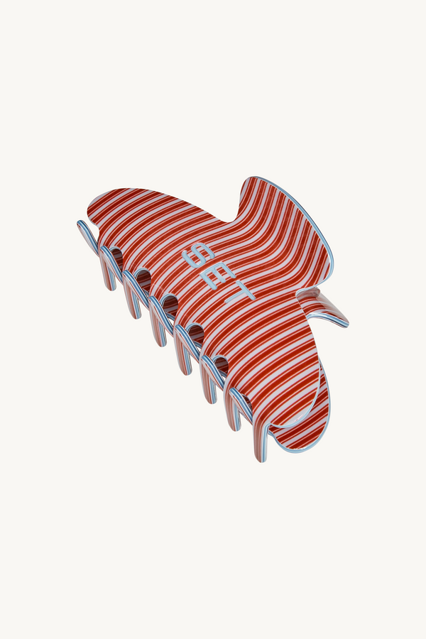 Red and white striped shoe on a white background