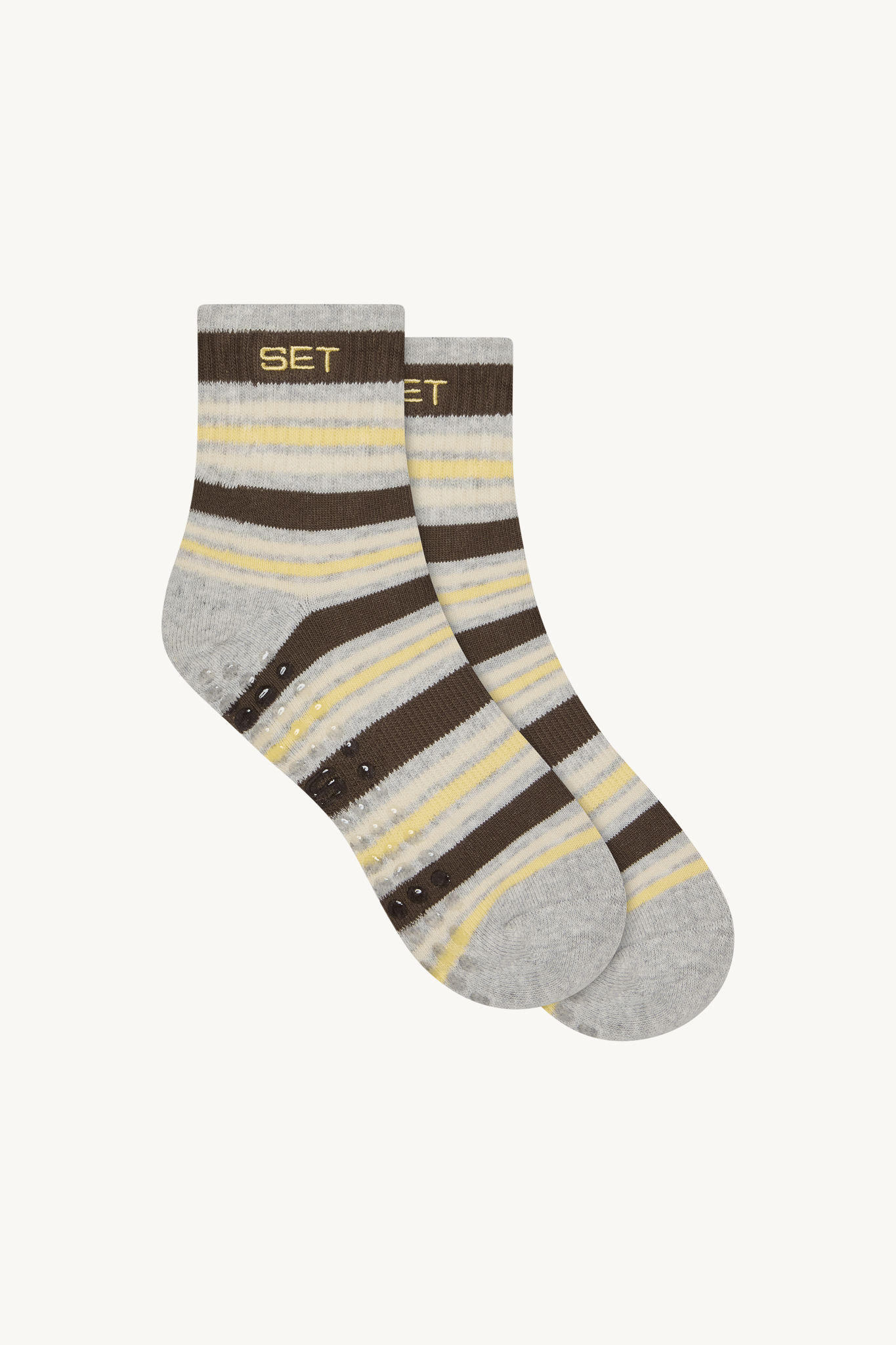 Pair of striped socks with gray, brown, and yellow colors on a white background