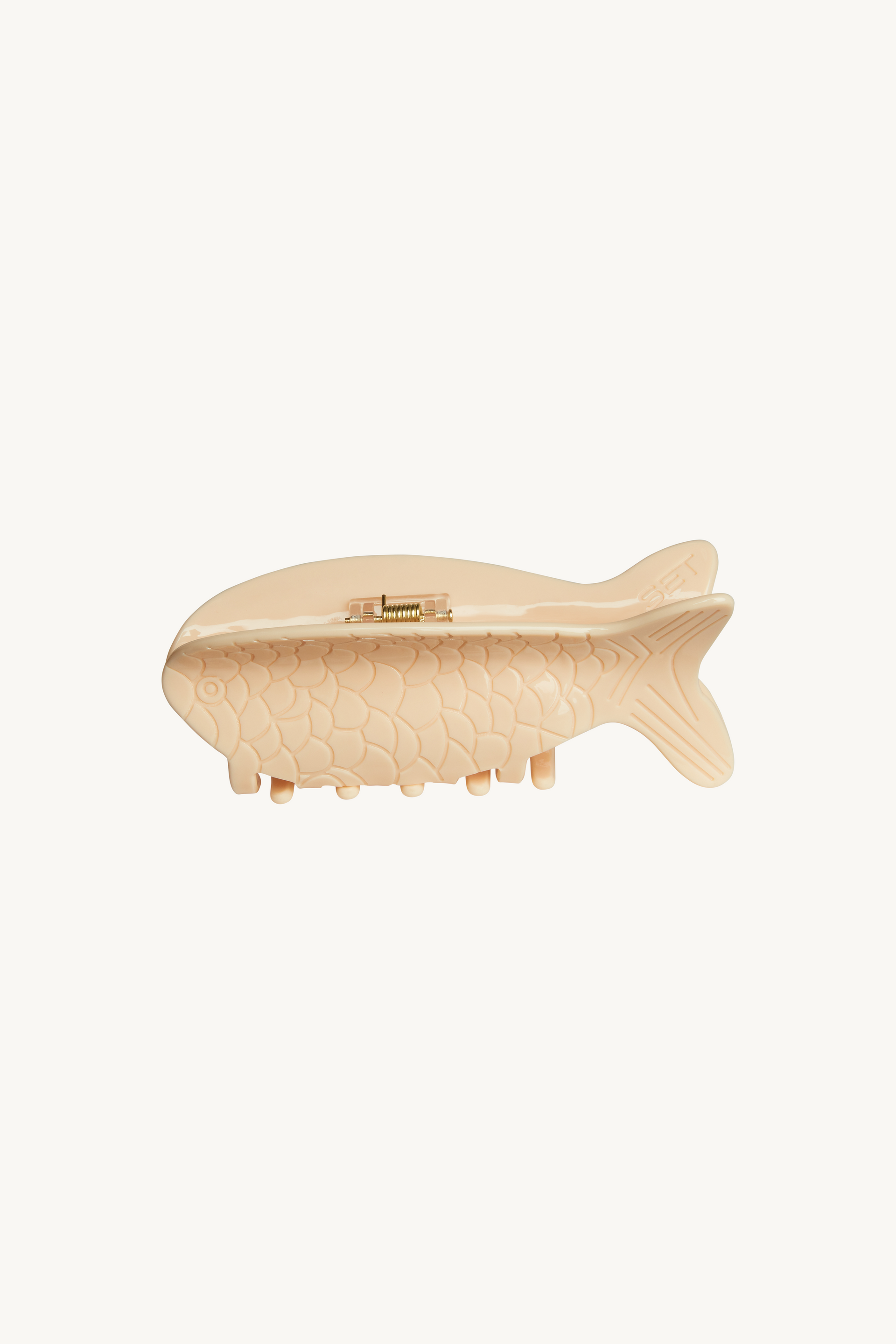 Wooden fish-shaped clip on a white background