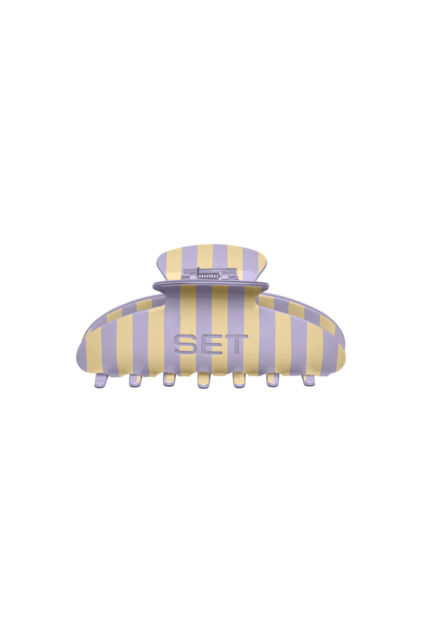 Yellow and purple striped hair clip with 'SET' branding on a white background