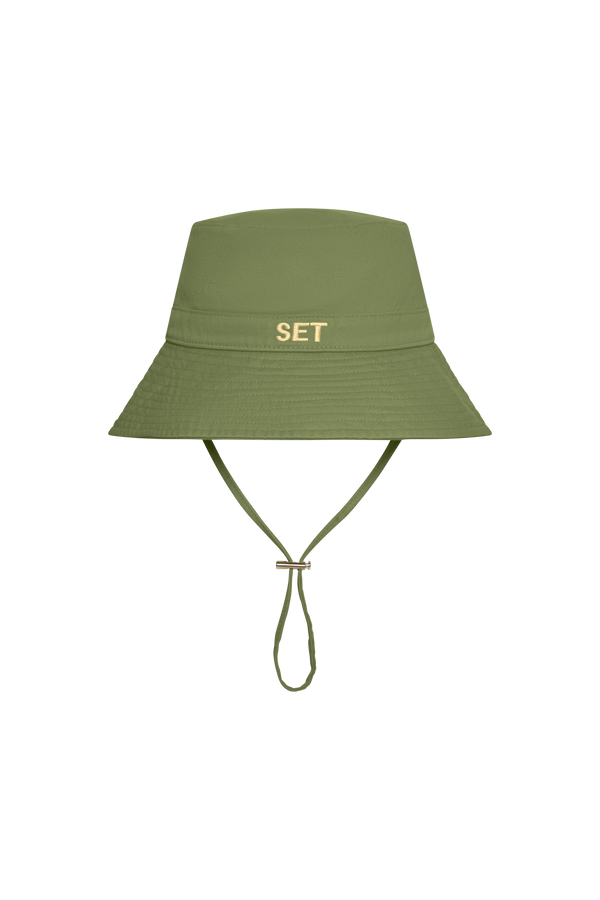 Green bucket hat with 'SET' logo on a white background