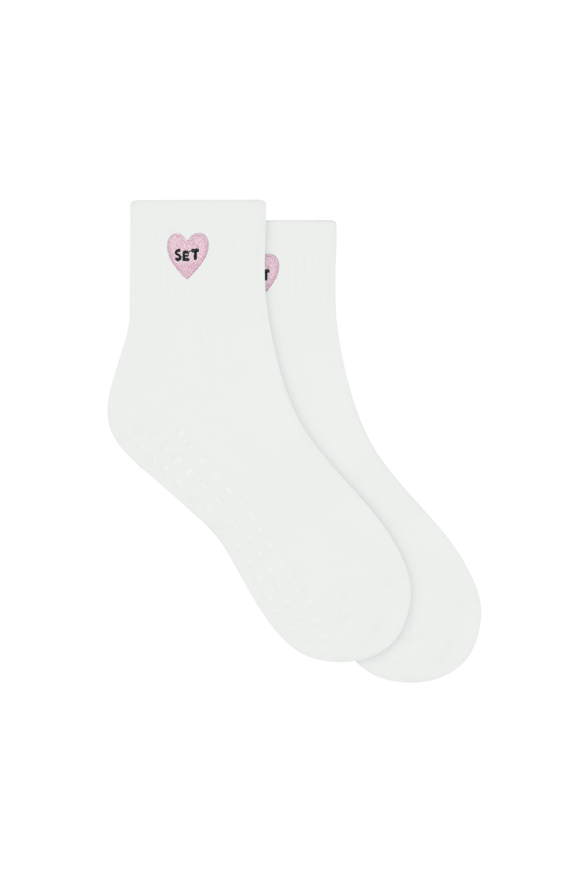 White socks with pink heart designs on a white background