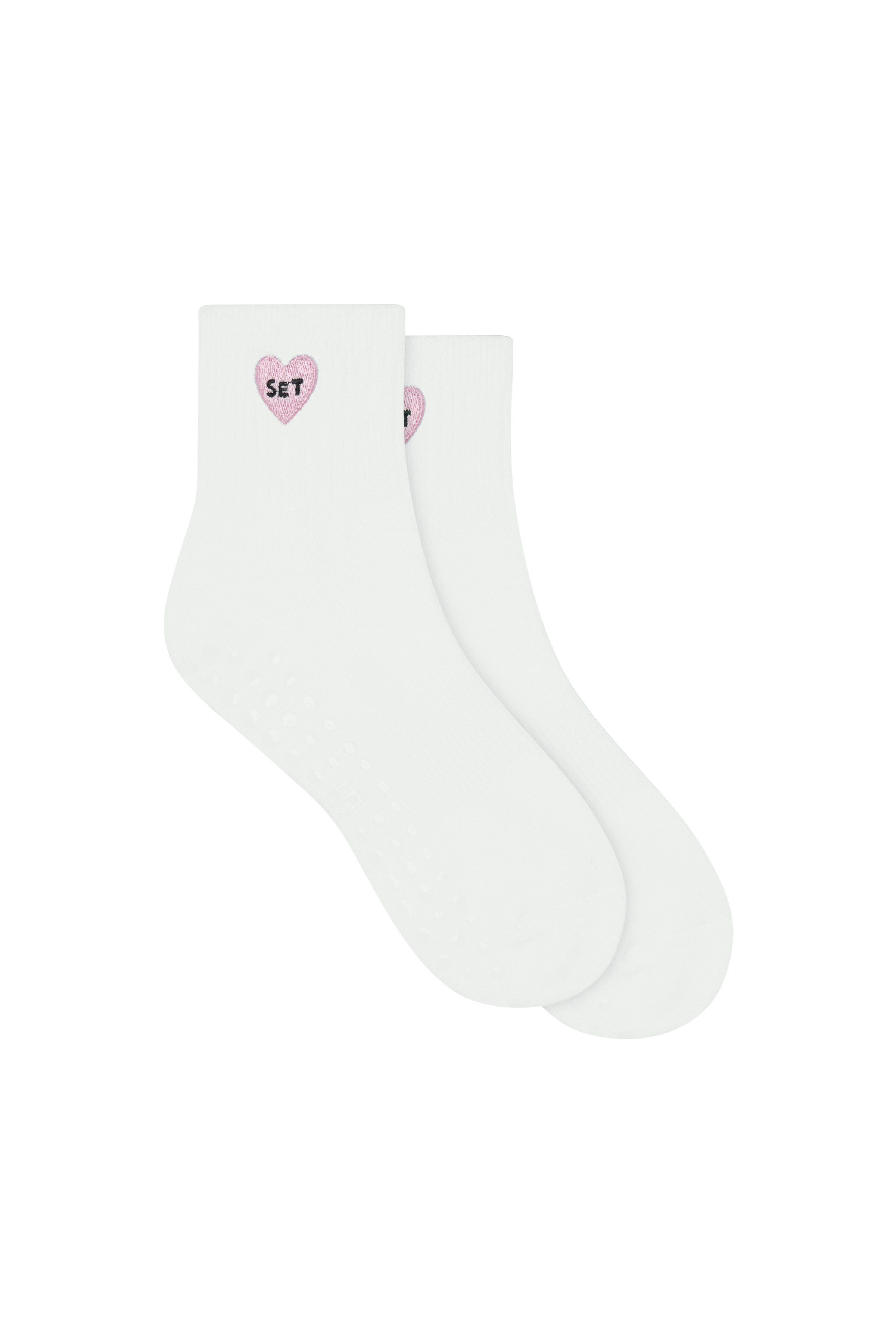White socks with pink heart designs on a white background