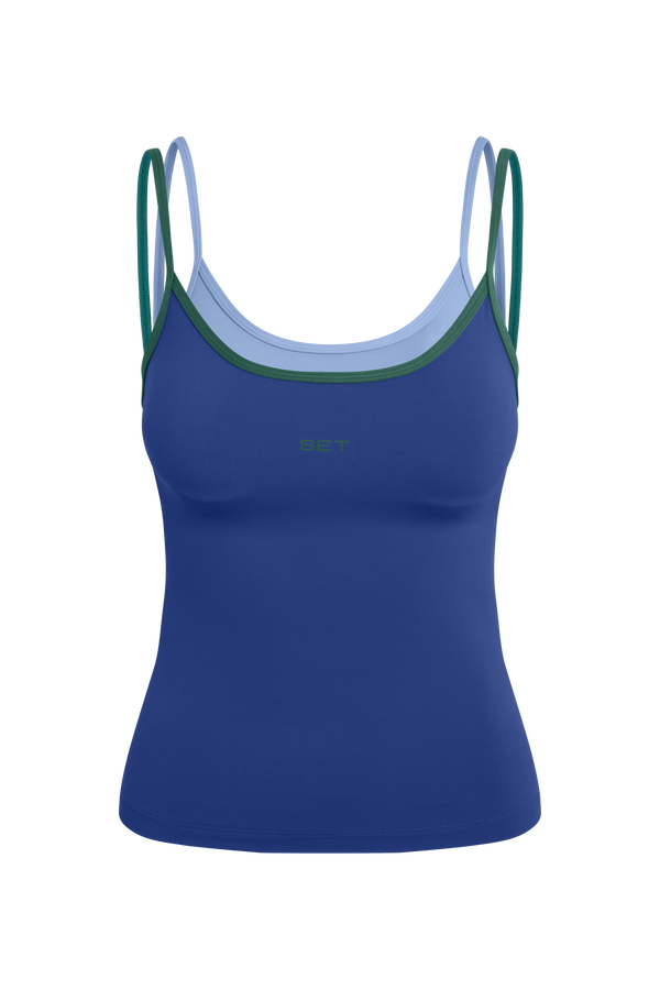 Blue tank top with green straps on a white background