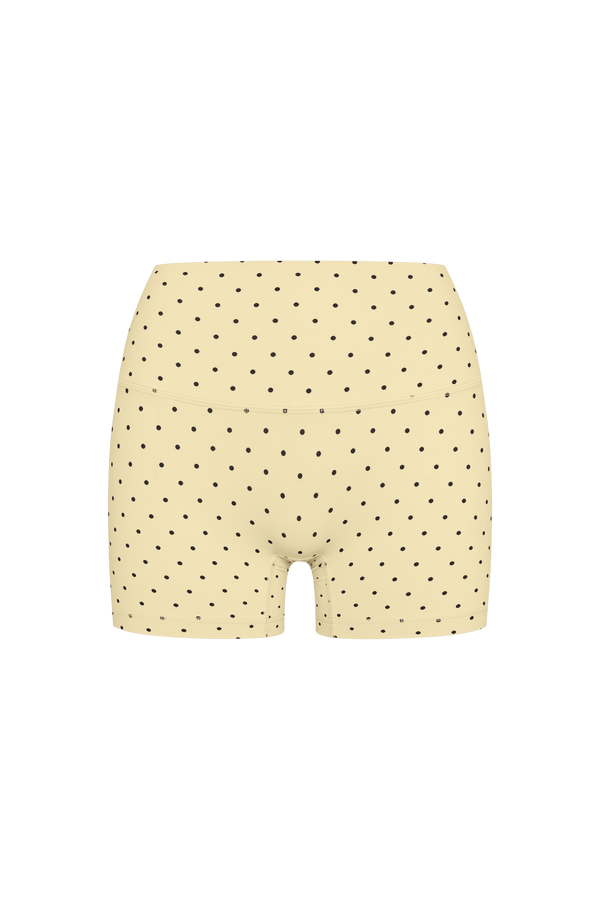 High-waisted beige boxer briefs with a black polka dot pattern, shown from the back on a solid white background.