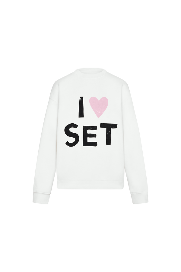 White sweatshirt with 'I ❤️ SET' text and pink heart on a white background