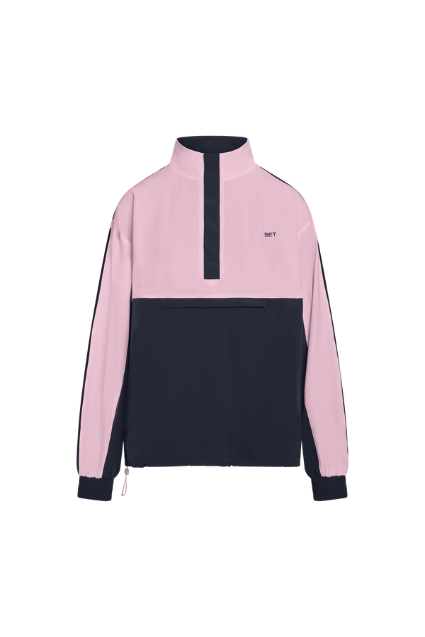 Pink and black pullover with a visible brand logo on a white background
