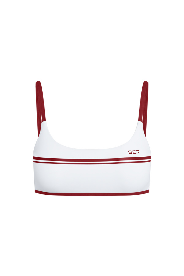 White sports bra with red accents on a white background