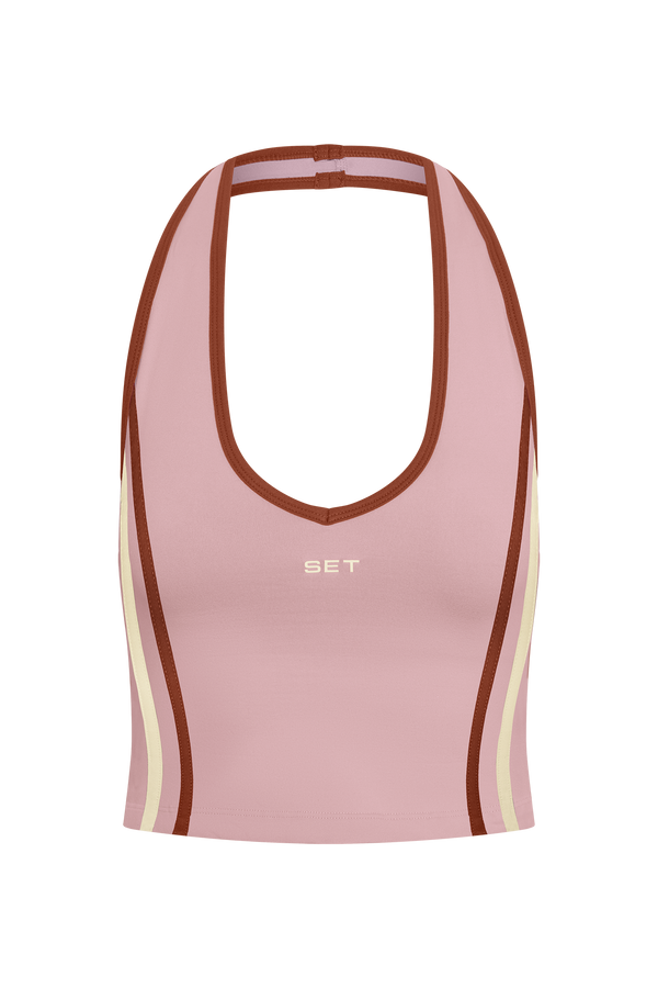 Pink sports bra with brown and beige accents on a white background