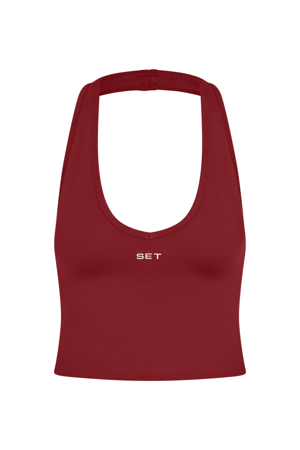 Red sports bra with 'SET' logo on a white background