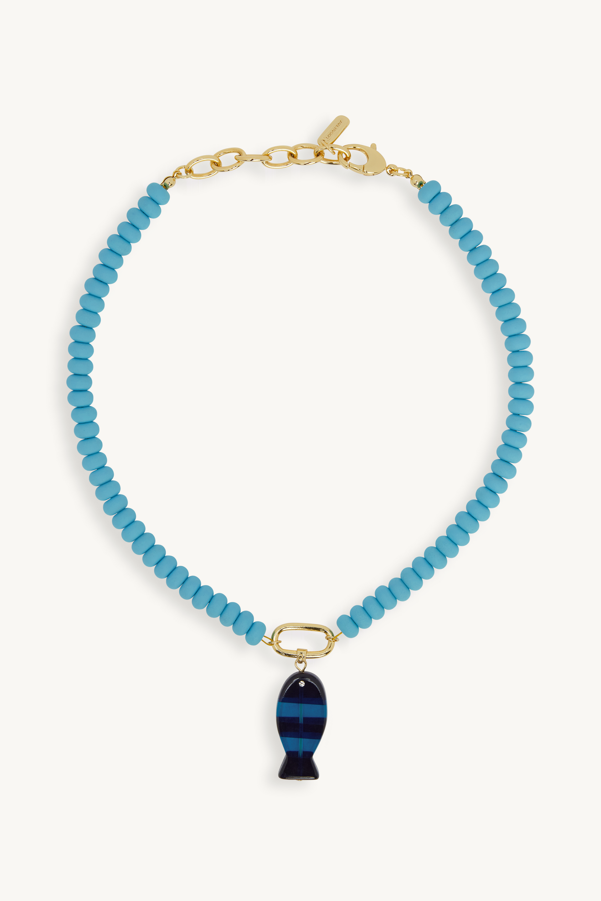 Blue beaded necklace with a fish-shaped pendant on a white background