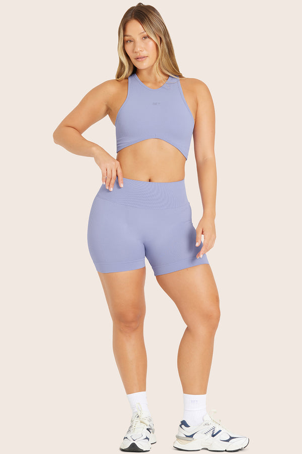 MODEL WEARS SCULPTFLEX® BIKE SHORTS IN LILY 