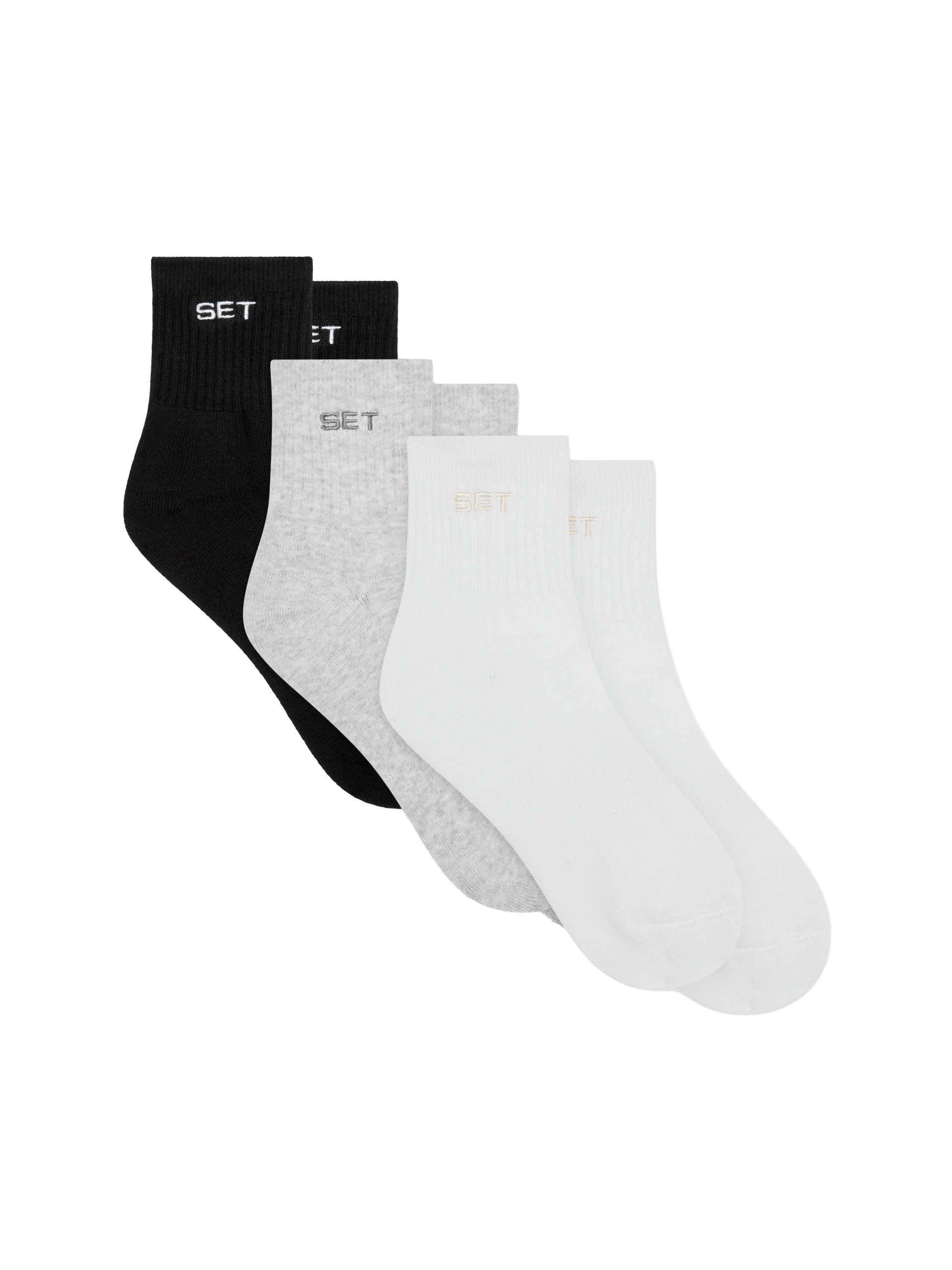 Set of black, gray, and white socks on a white background
