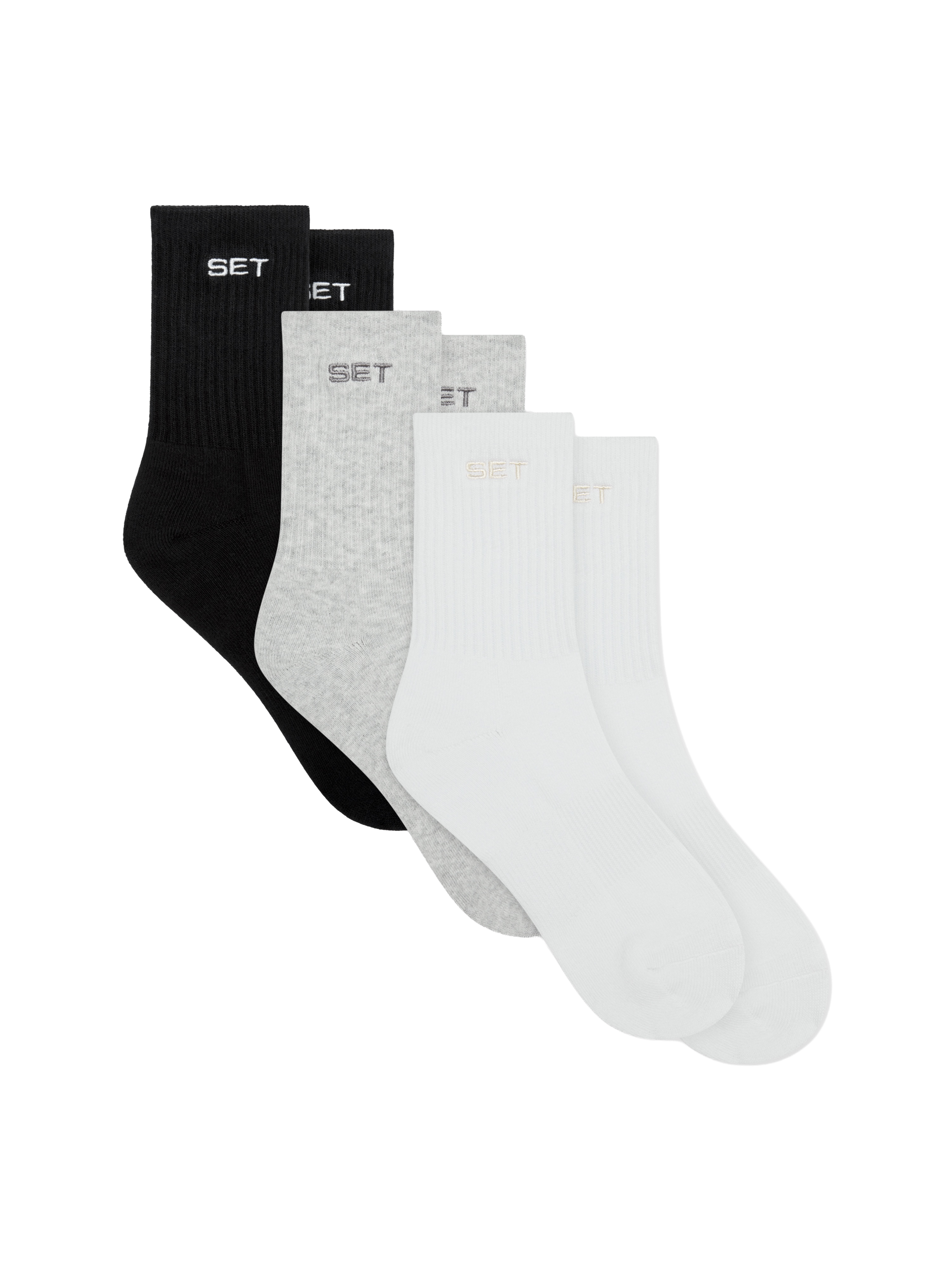 Set of three socks in black, gray, and white on a white background