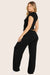 MODEL WEARS SLEEP JERSEY CLASSIC SLEEP PANTS IN ONYX 