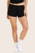 MODEL WEARS SLEEP JERSEY RELAXED SLEEP SHORTS IN ONYX <model-info>Gabbie wears a size S and is 5’6", 26" waist, 34" bust, 34B bra.</model-info>
