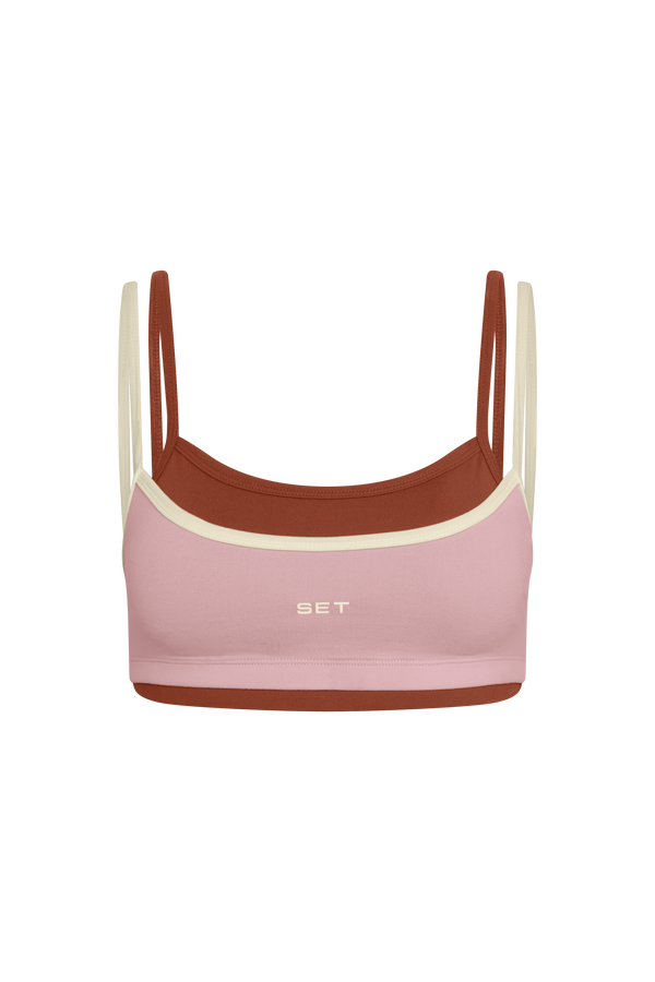 Two-tone pink and brown bralette with 'SET' branding on a white background