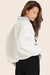 MODEL WEARS SET X PARKE REVERSIBLE VARSITY MOCKNECK IN PARKE HEATHER GREY 