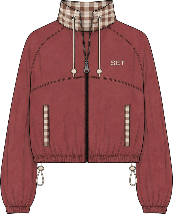 A flat-lay fashion illustration of a cropped zip-up jacket in dusty rose red, featuring a brown and beige gingham pattern on the collar, hood lining, and vertical zippered pockets. The jacket has 'SET' printed in white on the left chest and is shown on a plain white background.