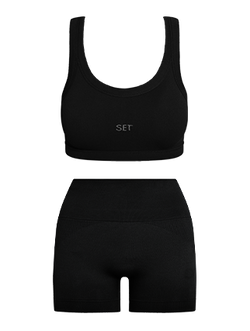 Black sports bra and shorts set with 'SET' branding on a white background
