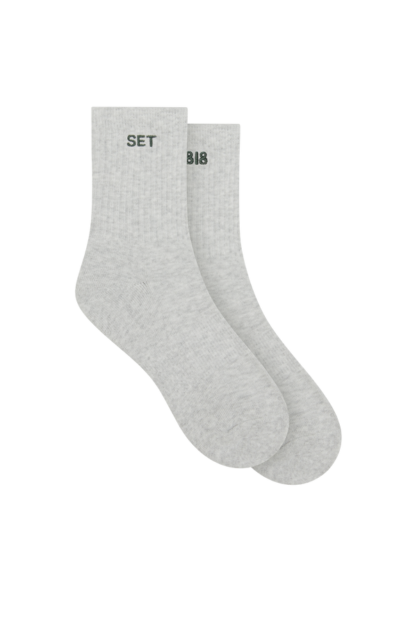 Gray socks with 'SET' and '818' text on a white background